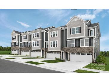 Beautiful new construction townhomes with stone accents, attached garages and inviting curb appeal at 5045 Grain Orchard Rd # 3027D, Indian Trail, NC 28079