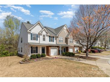 Charming townhomes with well-maintained lawns and inviting curb appeal on a sunny day at 1026 Eagles Nest Ln, Fort Mill, SC 29707