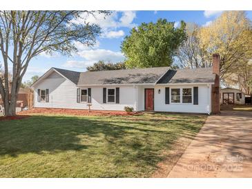 Charming home with a well-maintained lawn, lovely landscaping and a classic white exterior at 4515 Country Meadows Dr, Gastonia, NC 28056