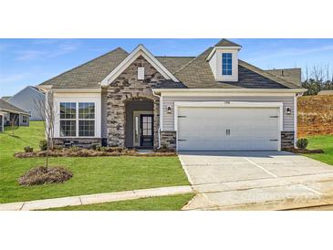 Charming home with a stone facade, two-car garage, and well-manicured lawn at 5926 Oak Branch Cir, Maiden, NC 28650