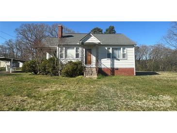 Charming home with a cozy front porch and well-maintained lawn at 514 W Blume St, Landis, NC 28088