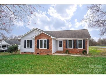 Charming single-story home featuring a brick facade, black shutters, and a well-maintained front lawn at 3001 Austin Chaney Rd, Monroe, NC 28110