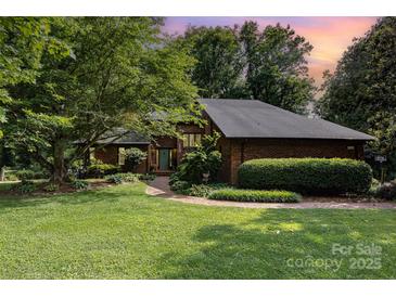 Charming brick home with a well-manicured front yard and inviting walkway at 3004 Vernell Ln, Shelby, NC 28150