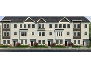 Charming townhome showcasing light siding, black accents, multiple windows, and well-manicured landscaping at 226 E Morehouse Ave # Twnh C, Mooresville, NC 28117