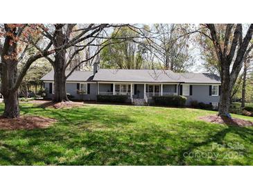 Charming single-story home with a spacious front yard and a welcoming covered porch at 2482 Kings Grant Rd, Lincolnton, NC 28092