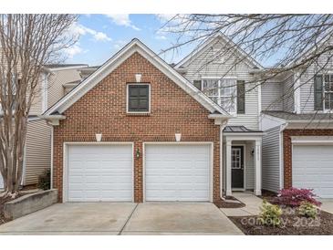 Charming two-story home with a two-car garage and well-maintained landscaping at 10015 Garrison Watch Ave # 168, Charlotte, NC 28277