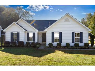 Charming single-story home featuring manicured landscaping and a well-maintained lawn at 611 Chase Brook Dr, Rock Hill, SC 29732