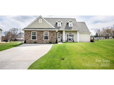 Inviting single-Gathering home with a long driveway and a well-maintained front lawn at 118 Heathrow Ln, Statesville, NC 28677