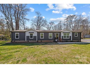 Charming single story home featuring two-tone siding and a well-maintained lawn at 119 Old Hearth Rd, Clover, SC 29710