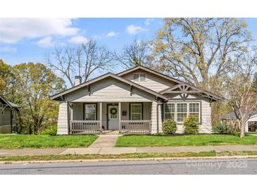 Charming craftsman home featuring a welcoming front porch and freshly landscaped yard at 306 7Th Sw St, Hickory, NC 28602