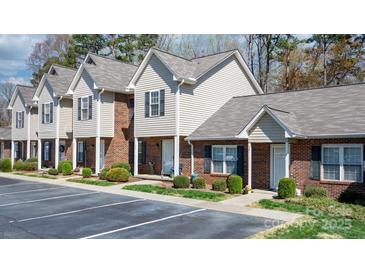 Charming townhomes featuring brick and vinyl siding with well-manicured lawns in a desirable community at 1100 22Nd Ne St # 502, Hickory, NC 28601