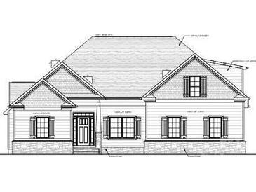 Charming home featuring a mix of stone and siding, complemented by symmetrically placed windows with shutters at 5947 Tipperary Dr, Denver, NC 28037