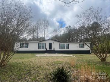 Charming single-story home with a well-maintained lawn and inviting entrance at 8502 Simpson Rd, Waxhaw, NC 28173