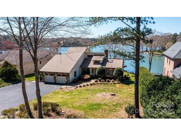 Charming waterfront home with stone accents, mature trees, and a two-car garage at 343 River Haven Dr, Taylorsville, NC 28681