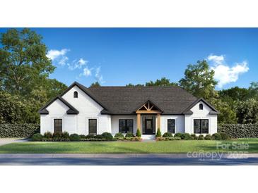 Charming one-story home with a modern black and white color scheme and well-manicured front yard landscaping at 104 Ardsley Way, Salisbury, NC 28147