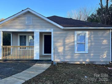 Charming single-story home featuring a covered porch and neutral siding at 2300 Olando St, Charlotte, NC 28206