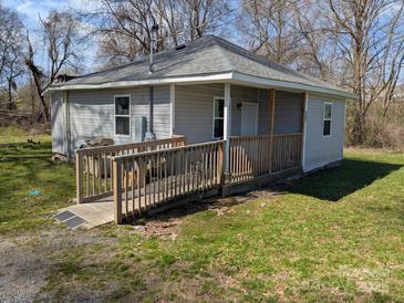 Charming single-story home with ramp, siding, and a well-maintained lawn at 301 Huffman Rd, Gastonia, NC 28056
