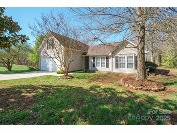 Charming single Gathering home with manicured lawn and attached two car garage at 5291 Moonlight Sw Trl, Concord, NC 28025