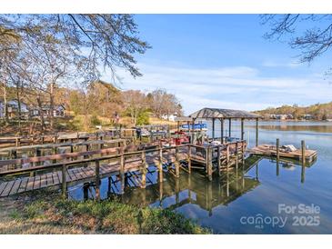 Waterfront home with private covered dock and boat slip for easy lake access and serene relaxation at 1657 Bowater Rd, Rock Hill, SC 29732