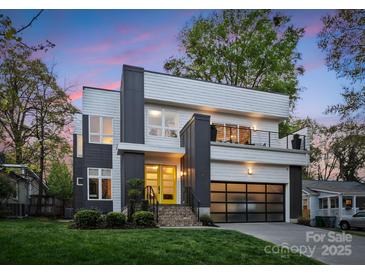 Modern two-story home with striking architectural details and a yellow front door at 2529 Daniel St, Charlotte, NC 28205