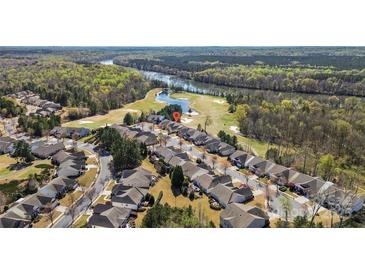 Beautiful aerial view of homes near golf course and a river surrounded by lush green trees and blue sky at 39617 Rosebay Ct, Fort Mill, SC 29707