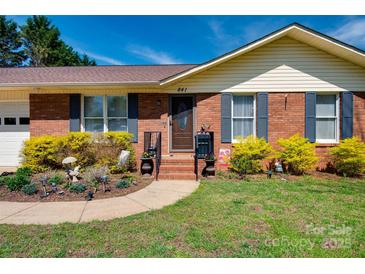 Charming brick home featuring a manicured lawn and walkway leading to the front door at 841 E Zion Church Rd, Shelby, NC 28150