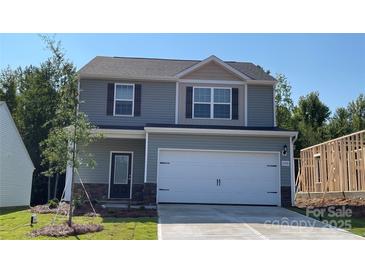 Charming two-story home featuring a two-car garage and a neatly landscaped front yard at 1530 Doran Ter, Richburg, SC 29729