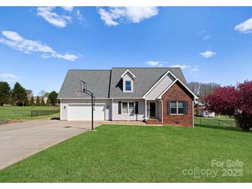Charming single-Gathering home with a basketball hoop, well-kept lawn, and a brick-accented facade at 238 Lippard Springs Cir, Statesville, NC 28677