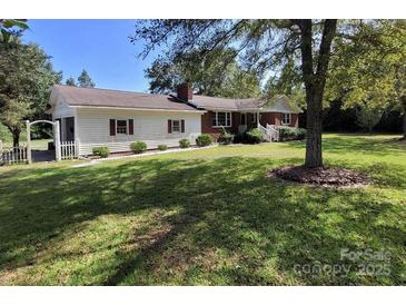 Charming home with a well-manicured lawn and mature trees, offering great curb appeal at 275 Ned Williams Rd, Kershaw, SC 29067