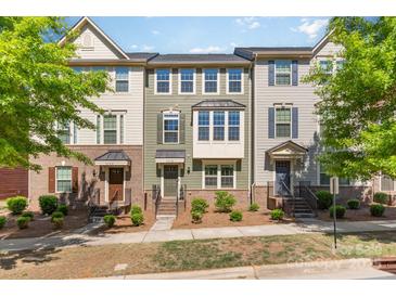 Charming townhomes with a variety of exterior colors and well-maintained landscaping at 3718 Speer Blvd, Charlotte, NC 28217