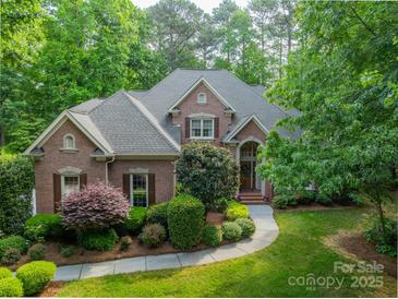 Beautiful brick home featuring manicured landscaping and a welcoming front entrance at 4646 Eagle Pointe Ct, Denver, NC 28037