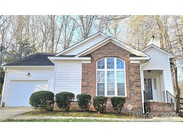 Charming single-story home with brick accents, a two-car garage, and a welcoming entrance at 5016 Haybridge Rd, Charlotte, NC 28269