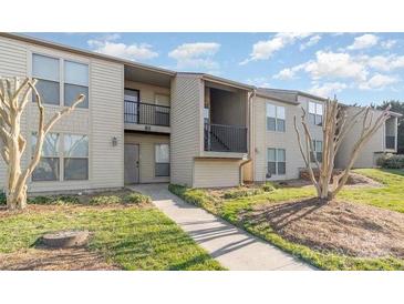 Attractive apartment complex with well-maintained landscaping and blue sky background at 11063 Running Ridge Rd, Charlotte, NC 28226
