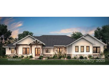 Charming exterior elevation with stone accents, vertical siding, dark metal roof, and mature landscaping at 5039 Eliza Long Wilkie Dr, Huntersville, NC 28078