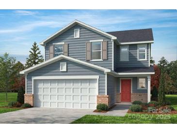 Charming two-story home with gray siding, red front door, white garage door, and well-manicured lawn at 141 Bellina Dr # 35, York, SC 29745