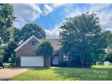 Charming brick home with a two-car garage and lush landscaping at 201 Fancy Lady Ct, York, SC 29745