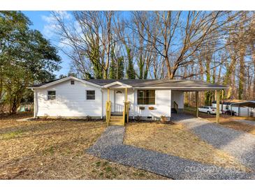 Charming single-story home featuring a covered carport and a welcoming front porch at 2706 Booker St, Gastonia, NC 28054