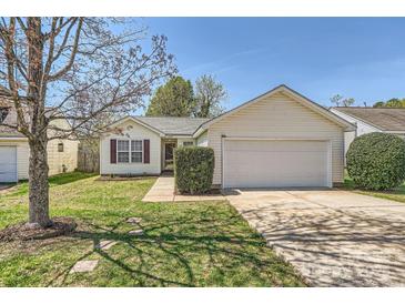 Charming home with well-maintained lawn, two-car garage and mature trees in a suburban neighborhood at 3023 Fairglen Rd, Charlotte, NC 28269