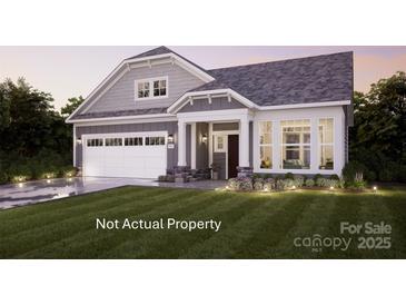 Charming home with a two-car garage, landscaped yard, and a cozy front porch at 4 Five Creek Rd # 4, Charlotte, NC 28213