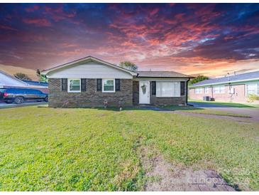 Charming brick home features an inviting front yard and black window shutters at 1108 Pearson Dr, Rock Hill, SC 29730