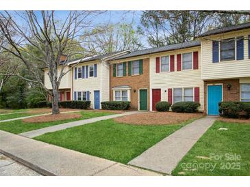 Charming townhomes featuring colorful doors, shutters and well-maintained lawns at 1113 Keswick Pl # 118, Monroe, NC 28112