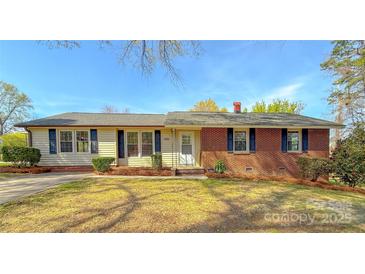Charming single-story home featuring brick and siding with well-maintained landscaping at 2020 Parkdale Ave, Gastonia, NC 28052