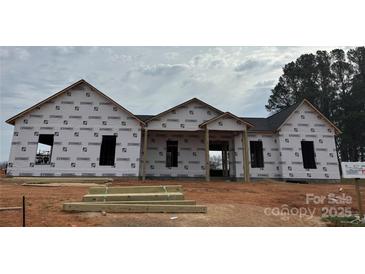 New construction home featuring a covered porch and modern design, currently under construction at 1429 Coppergate Dr, Salisbury, NC 28147