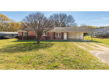 Charming brick ranch home featuring a convenient carport and a well-maintained front lawn at 260 Trexler Ln, Rock Hill, SC 29732