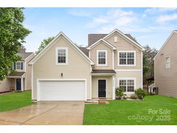 Charming two-story home with a well-maintained lawn and attached two car garage at 3725 Catawba Creek Dr, Gastonia, NC 28056