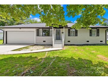 Charming single-story home with light colored exterior and a well-maintained front yard at 504 Katherine Ave, Kings Mountain, NC 28086