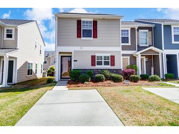 Charming townhome with neat landscaping and inviting curb appeal on a sunny day at 309 River Clay Rd, Fort Mill, SC 29708