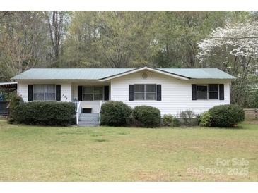 Charming single-story home featuring black shutters, white siding, and a well-maintained front lawn at 554 Trexler Ln, Rock Hill, SC 29732