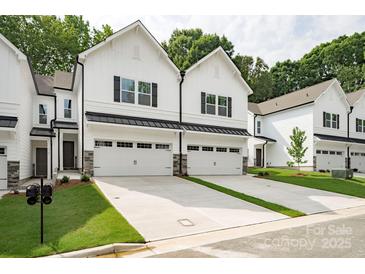 Charming new construction featuring attached garages and modern farmhouse design at 19751 Feriba Pl, Cornelius, NC 28031