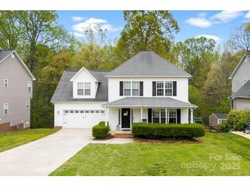 Charming two-story home with manicured lawn, attached two-car garage, and inviting front entrance at 4380 Timberwood Dr, Gastonia, NC 28052